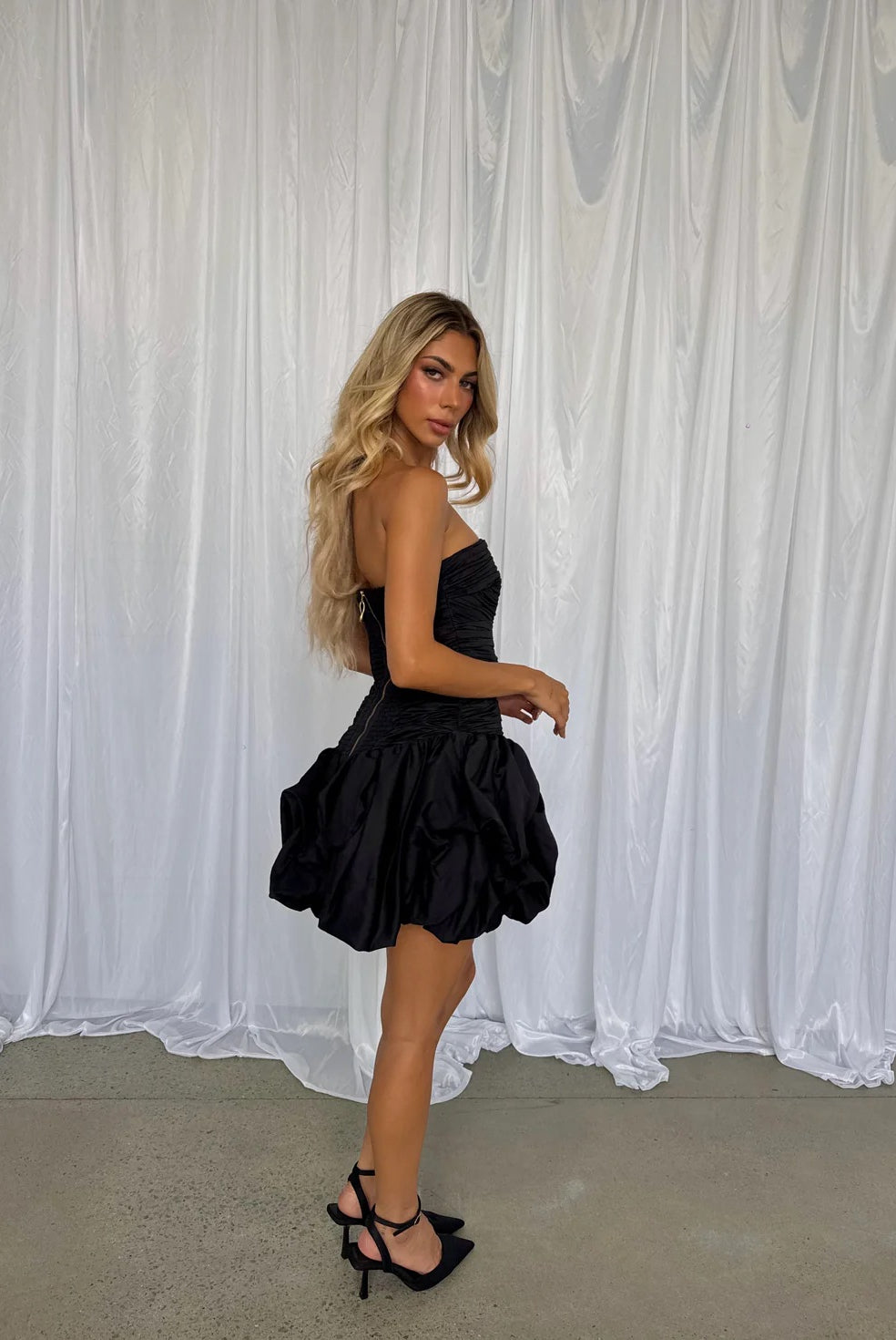 Violette Bubble Hem Mini in Black by Aje available for hire in Gold Coast, QLD