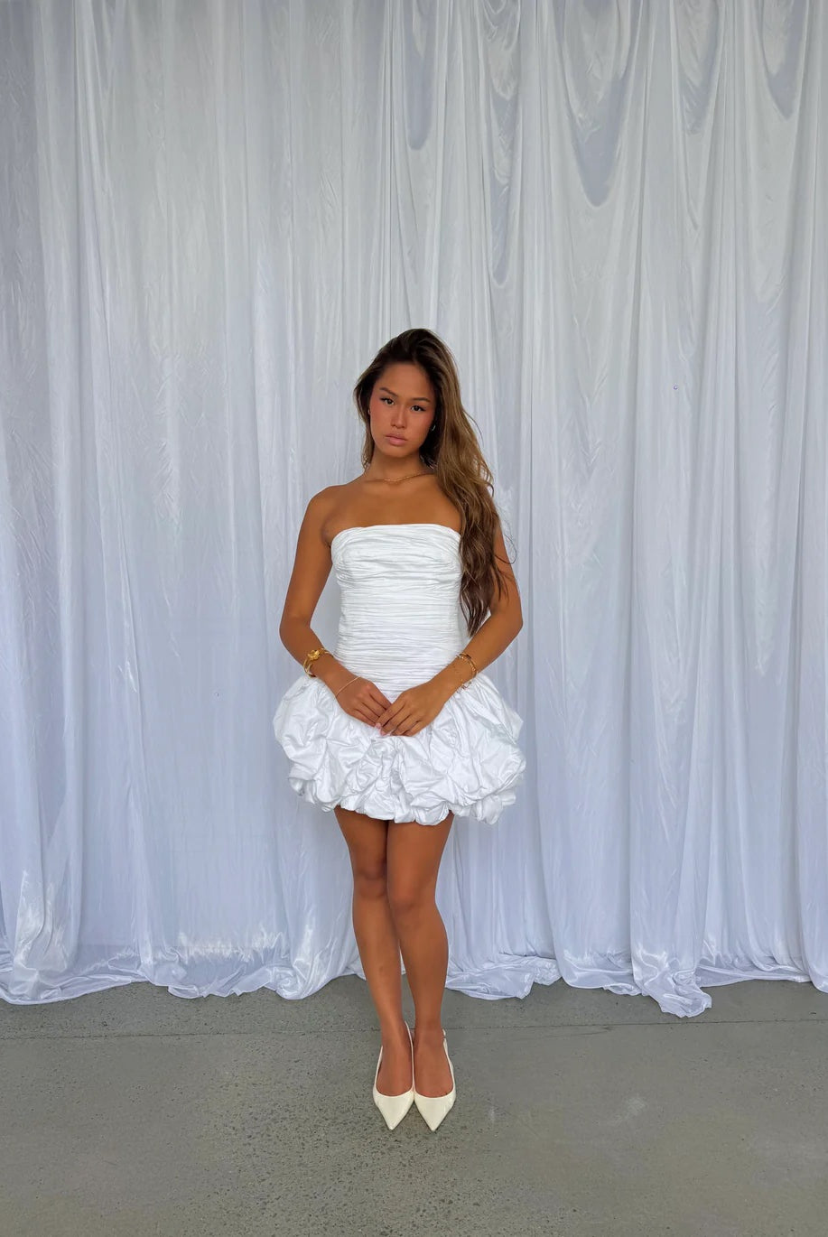 Violette Bubble Hem Mini in Ivory by Aje available for hire in Gold Coast, QLD