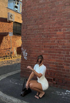 Benny coconut mini  by Kookai available for hire in Hillside, VIC