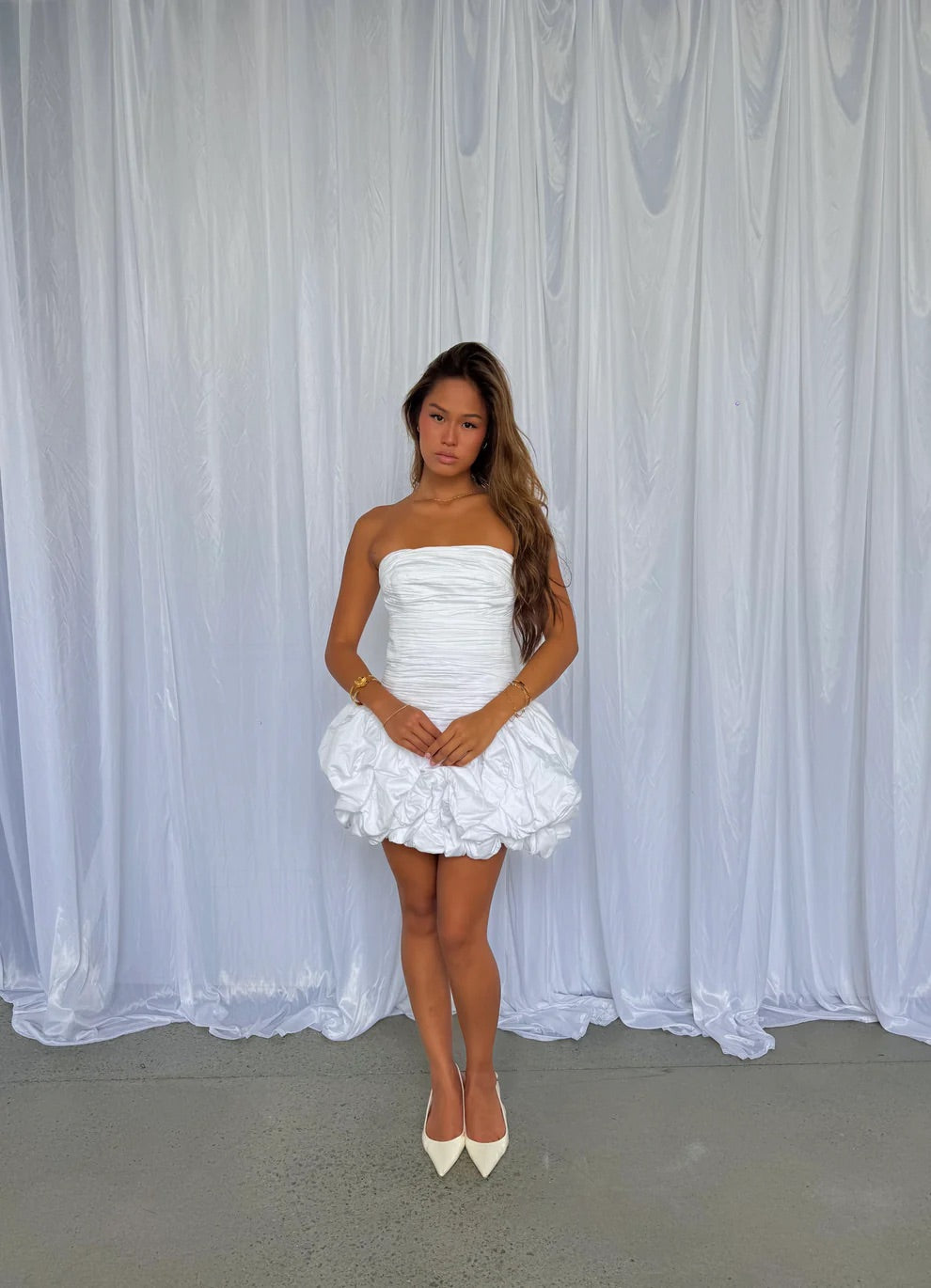 Violette Bubble Hem Mini in Ivory by Aje available for hire in Gold Coast, QLD